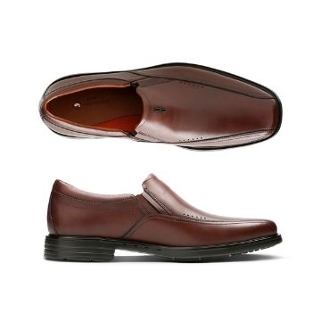 Side view of the Sheridan Go dress shoe by Clarks has elacstic side slip and line details and the top shoes the brown leather uppers with tan footbed