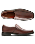 Side view of the Sheridan Go dress shoe by Clarks has elacstic side slip and line details and the top shoes the brown leather uppers with tan footbed