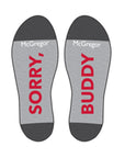 Grey soles of socks which read Sorry, Buddy in red.