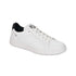 Leather sneaker in all white with black heel accent and flat white outsole.