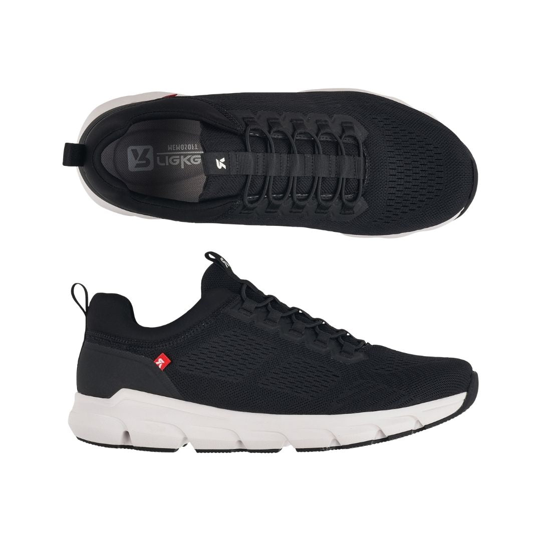 Top and side view of black slip on sneaker with elastic laces, heel pull tab and white outsole.
