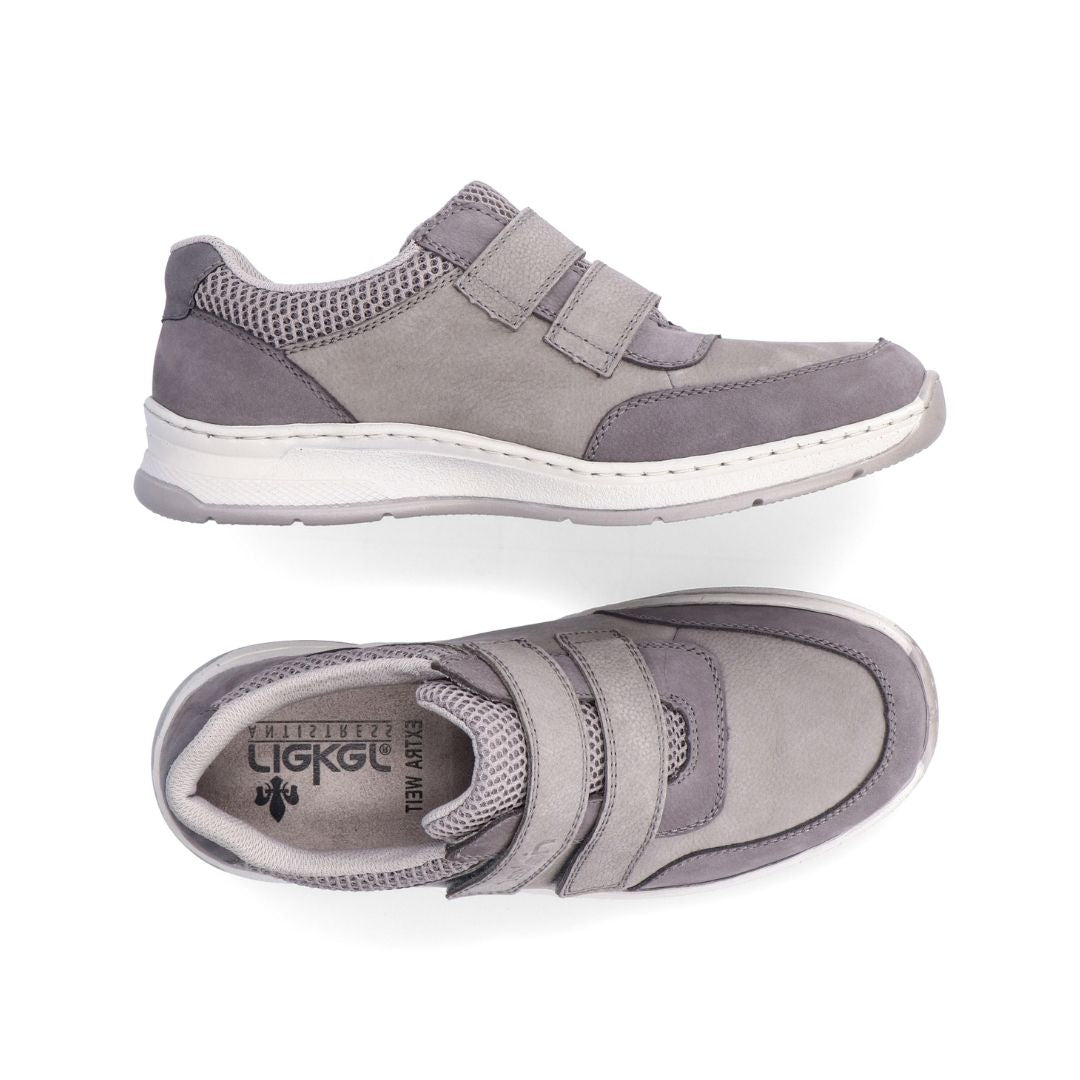 Grey shoe wtih two elastic straps, white midsole and grey outsole