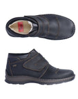 Top and side view of men's Rieker ankle boot with Velcro closure. White lining and red Rieker logo tag on insole.