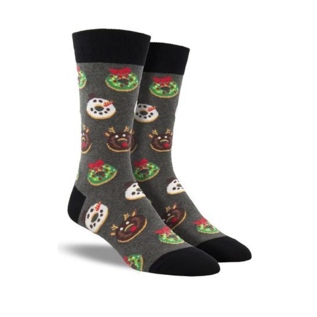 Socksmith Men&#39;s Decorative Donuts Socks feature festive donuts styled as wreaths, snowmen, and reindeer on a dark gray cotton crew sock. Ideal for Christmas holiday wear.