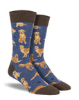 A pair of men's blue crew socks with golden retrievers on them.