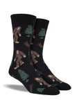 Black socks with Bigfoot, tree, and footprint pattern.