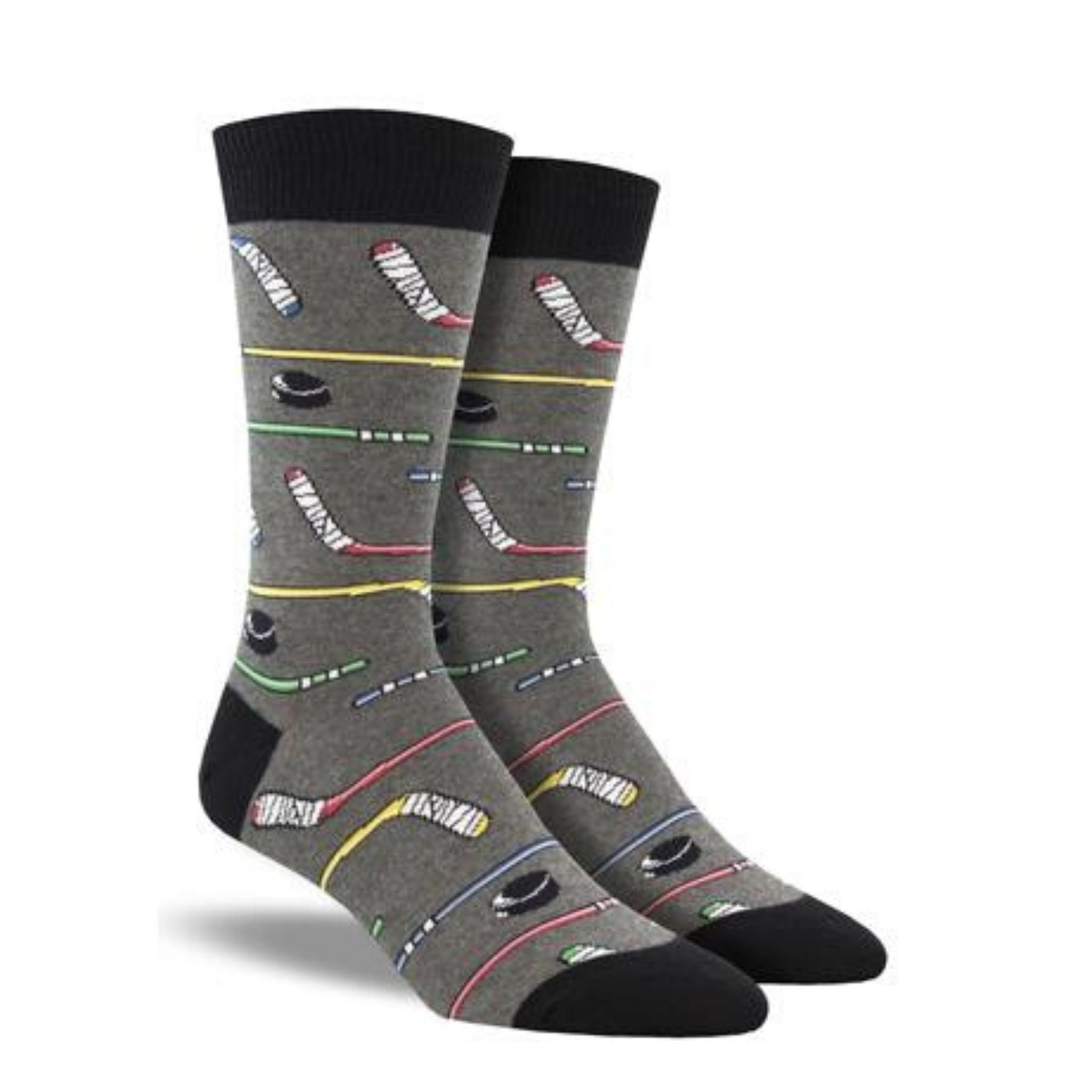 A pair of grey crew socks with hockey sticks on them.