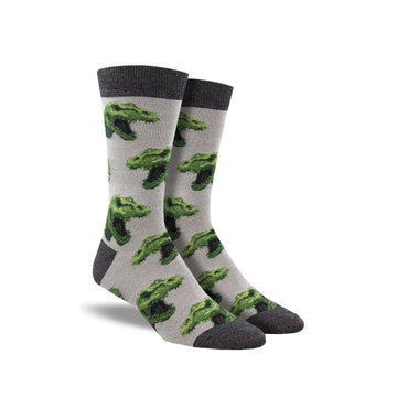 Grey socks with dark grey accents and T-rex heads on it