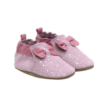 Pink leather shoes with a bow detail.