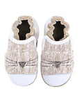 White, beige and gold shoes with white toe cap and cat whiskers across front.