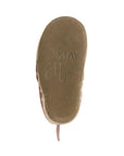 Brown suede leather outsole of Robeez Evie unicorn shoes with imprint saying 'stay magical'