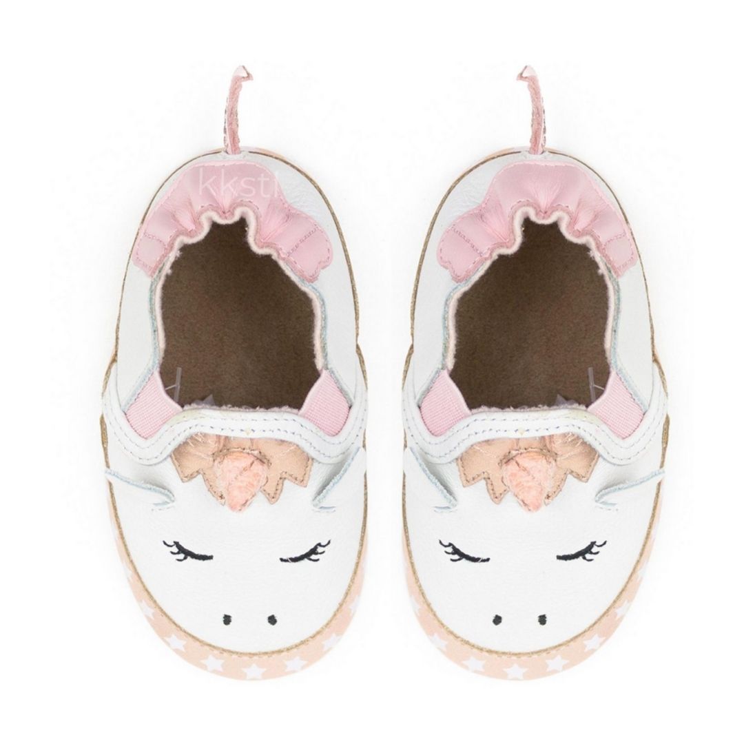 A pair of white leather shoe with 3D unicorn design.