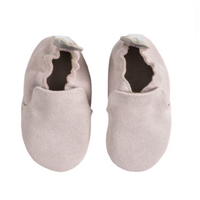 A pair of pink glittery baby shoes with grey outsoles and stars on the heels.