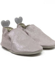 Pink glittery baby shoes with grey outsoles and stars on the heels.