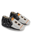 Pair of Robeez soft soles with black space design and rocket ships on toes