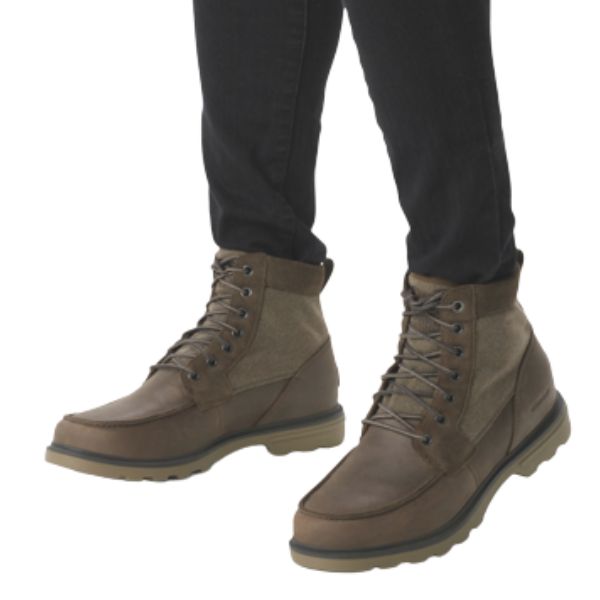 Man in black pants wearing brown lace up combat boot.