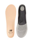 Top view of beige Superfeet insole beside bottom view of black and grey Superfeet insole.