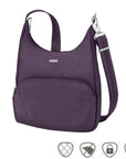 Purple messenger bag with adjustable shoulder strap, front zippered pocket and silver Travelon logo 