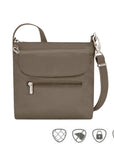 Taupe crossbody bag with front flapped pocket and front horizontal zippered pocket. Bag has silver zippers and clasps