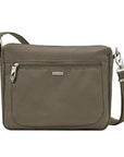 Small nutmeg travel bag with front zipper, silver clasps and silver Travelon logo in centre.