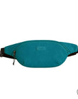 Teal fanny pack with zippered closure and Travelon emblem on front.