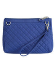 Blue quilted crossbody bag. Bag has removable wristlet strap.