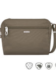 Small taupe crossbody bag with silver Travelon logo in center below full length zipper. 