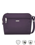 Small purple crossbody bag with silver Travelon logo in center below full length zipper.