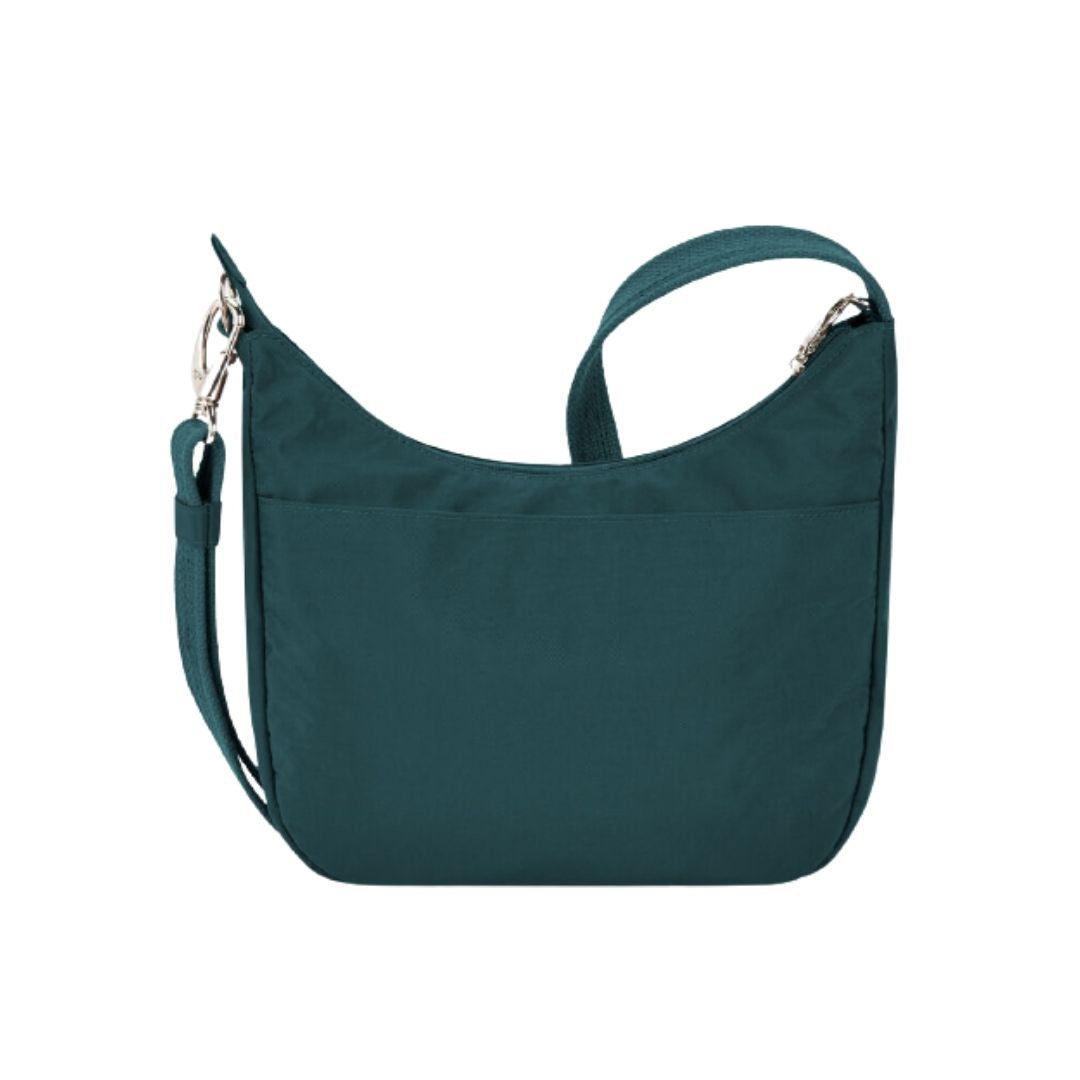 Back view of teal Travelon Anti-Theft Essentials bag with back pocket