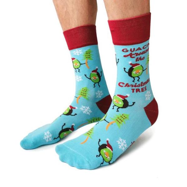 Socks from Uptown Sox showing Christmas trees and avocados people. Says, "Guacin' Around The Chritmas Tree."