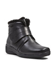 Black ankle boot with thick fold over Velcro strap and black fur trim