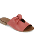 Bueno made coral coloured leather slide sandal with bow detail.