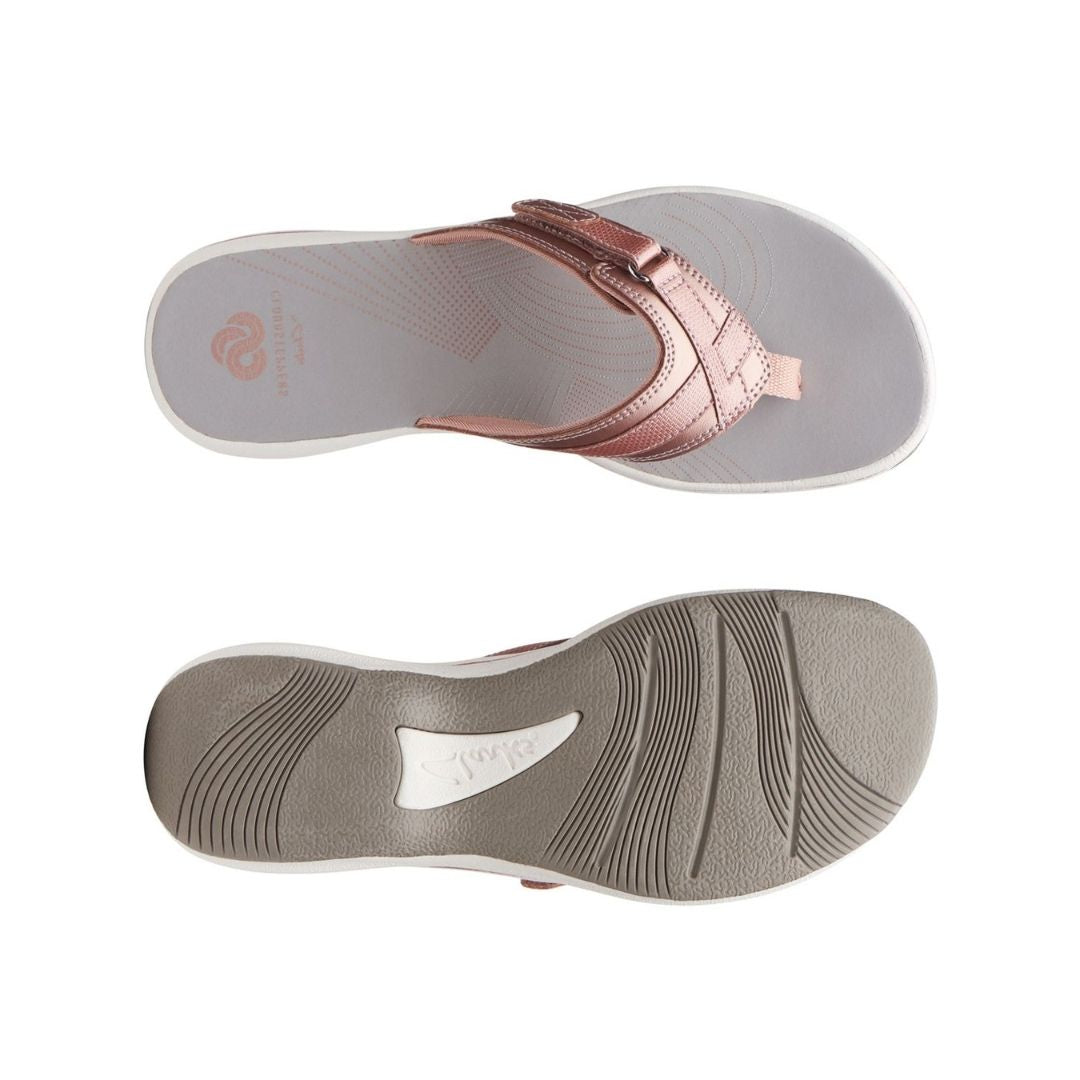 Thong sandal with white and grey footbed and rose gold upper with cute velcro close detail from top and side view