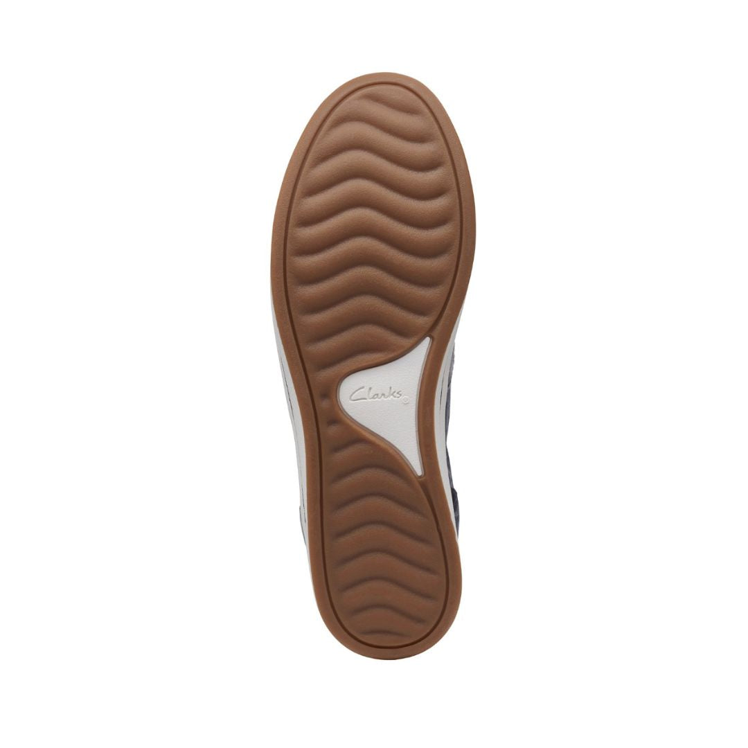 Brown and beige rubber outsole with Clarks logo in center.