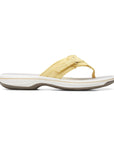Yellow flip flop with white midsole and grey outsole.