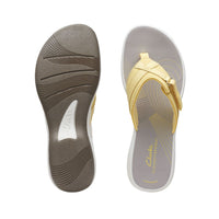 Top and side view of thong sandal with white and grey footbed and yellow upper with cute Velcro close detail. Clarks logo imprinted on insole at heel.