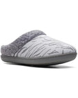 Slip on grey leopard printed slipper with grey faux fur trim and grey outsole.