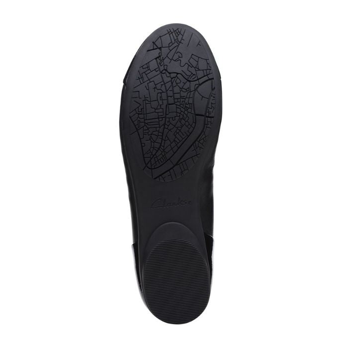 Black rubber outsole with Clarks logo in center.