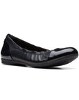 Black leather ballet flat with patent toe cap and heel.
