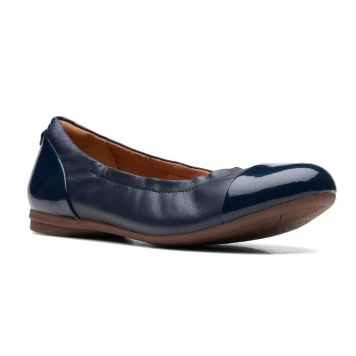 Navy leather ballet flat with patent toe cap and heel.