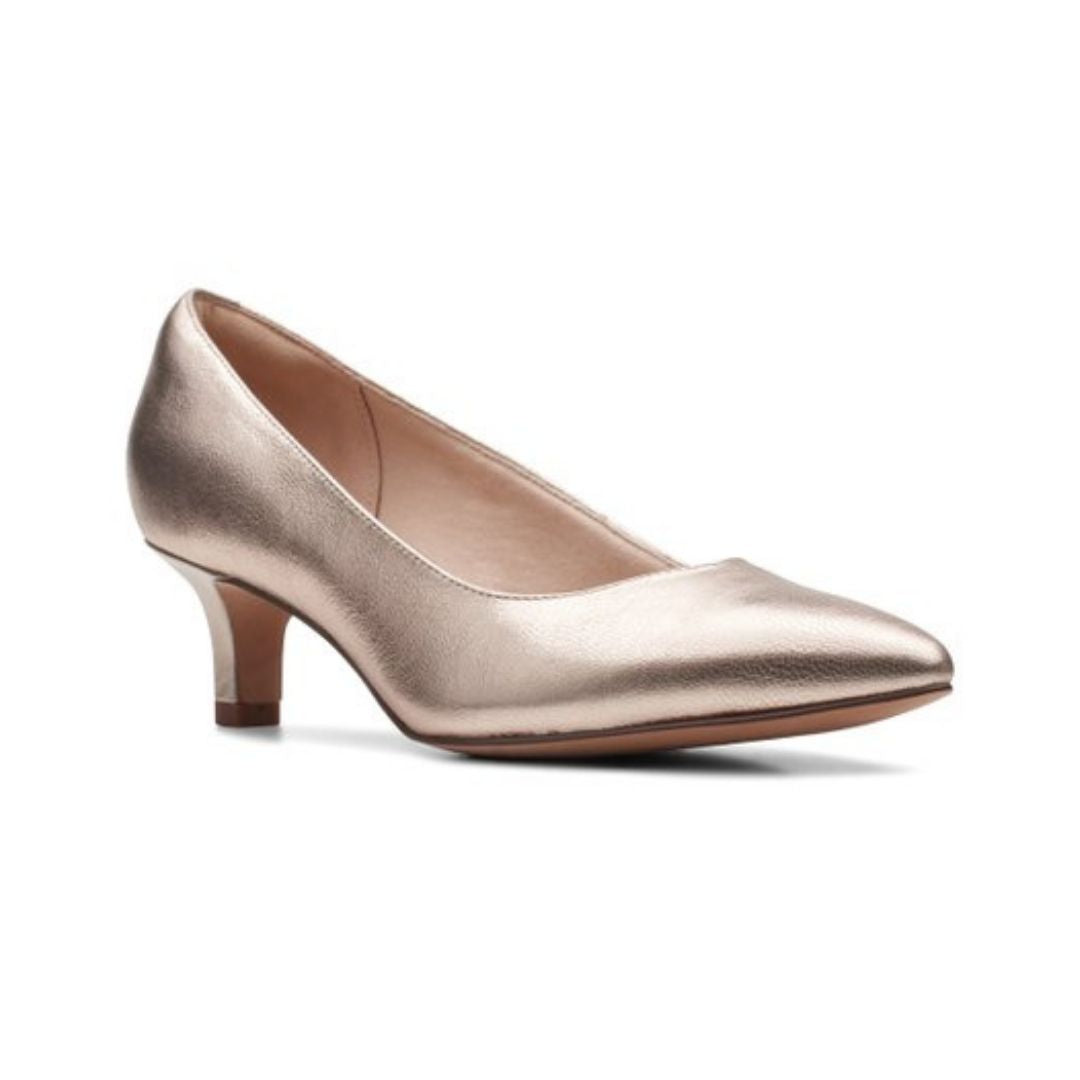 Rose gold pump with pointed to and kitten heel. 