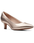 Rose gold pump with pointed to and kitten heel. 