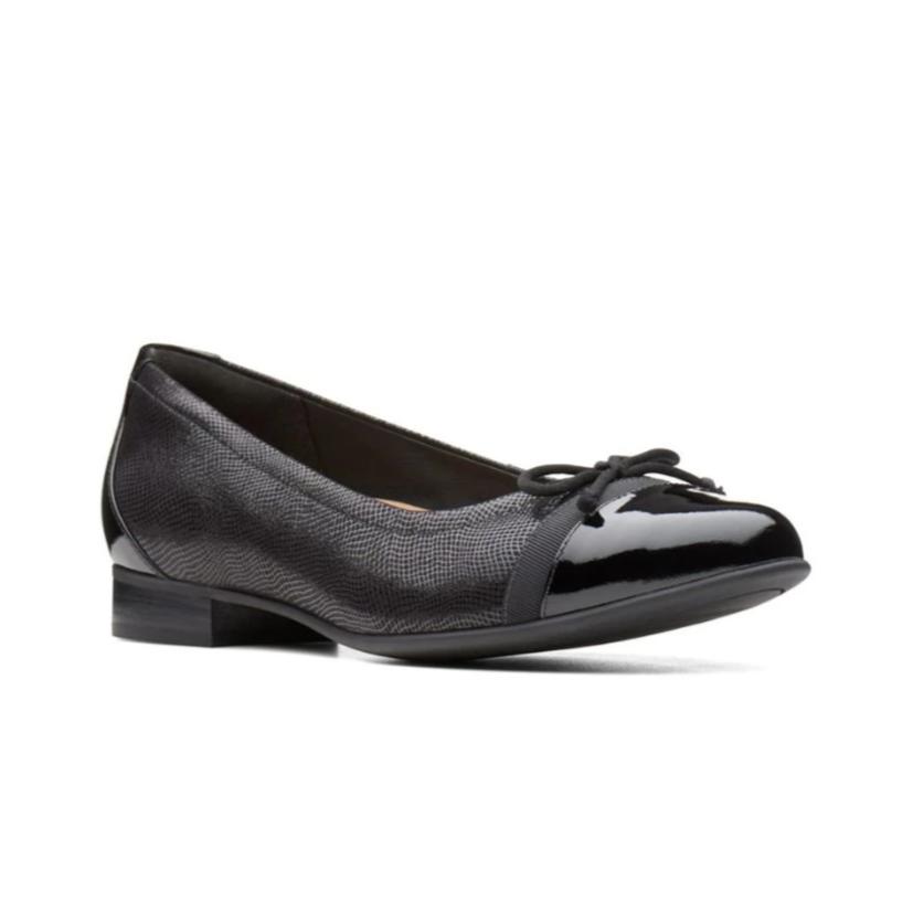 Black textured flat with shiny toe and heel section with thin bow at the toe of this Cap 2 by Clarks