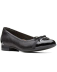 Black textured flat with shiny toe and heel section with thin bow at the toe of this Cap 2 by Clarks