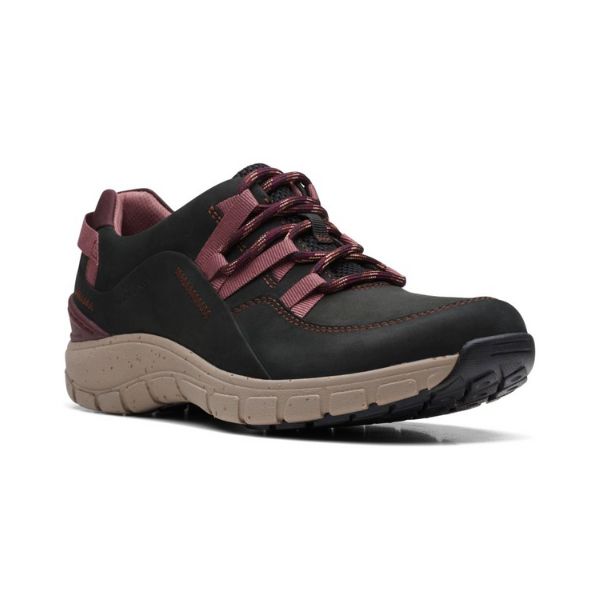 Black lace up sneaker with burgundy laces and beige outsole.