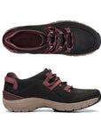 Black lace up sneaker with burgundy laces and beige outsole.