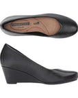 Top and side view of black leather wedge shoe. Clarks logo printed on insole.