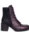 Inside view of purple and back heeled boot with zipper and lace closure.
