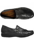 Top and side view of black slip on shoe with front gathering and pewter button.