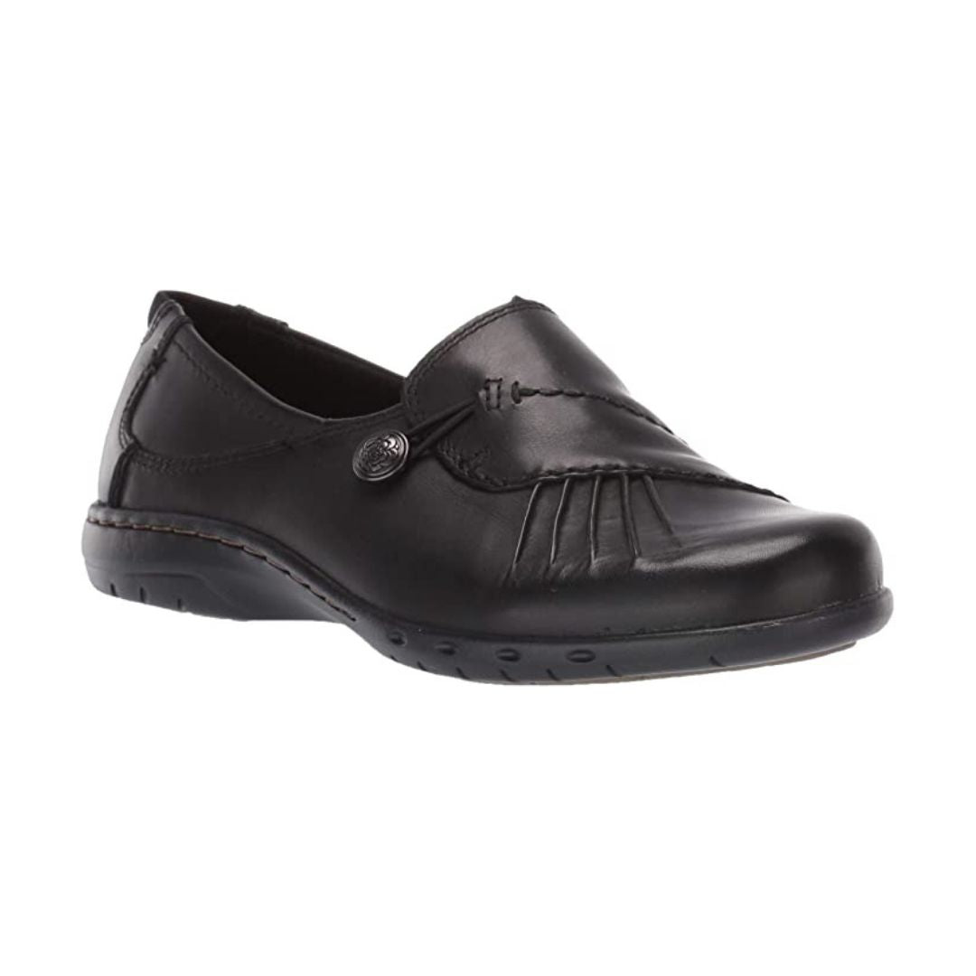 Black slip on shoe with front gathering and pewter button.